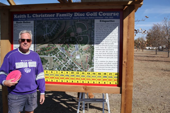 Hutchinson resident Rex Christner stands in front of a sign in Carey Park showing the outlay and details of the new 18-hold Keith L. Christner Family Disc Golf Course that he, his family and city staff have built in the park. The course is now open for play